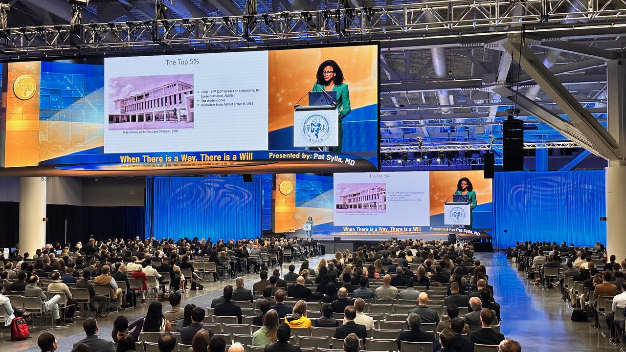 Large-scale medical conference with LED wall and packed convention center audience